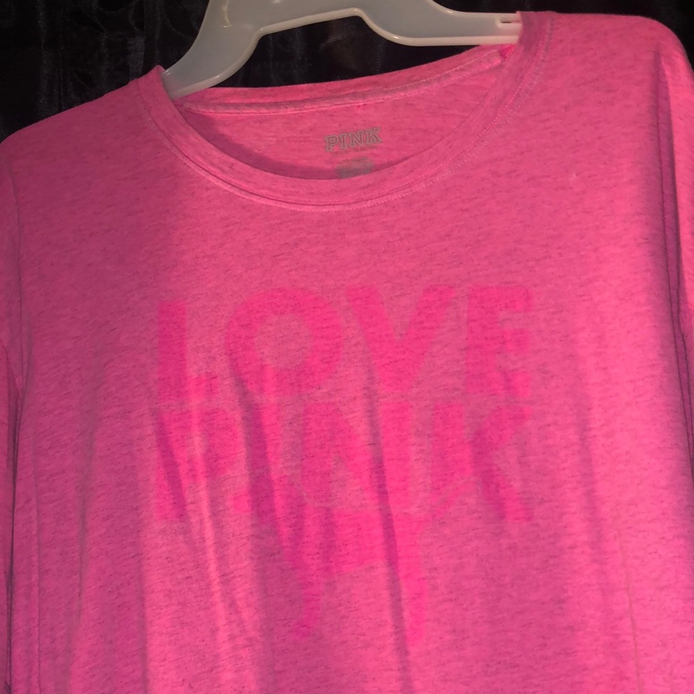 It is a hot pink shirt from the brand pink